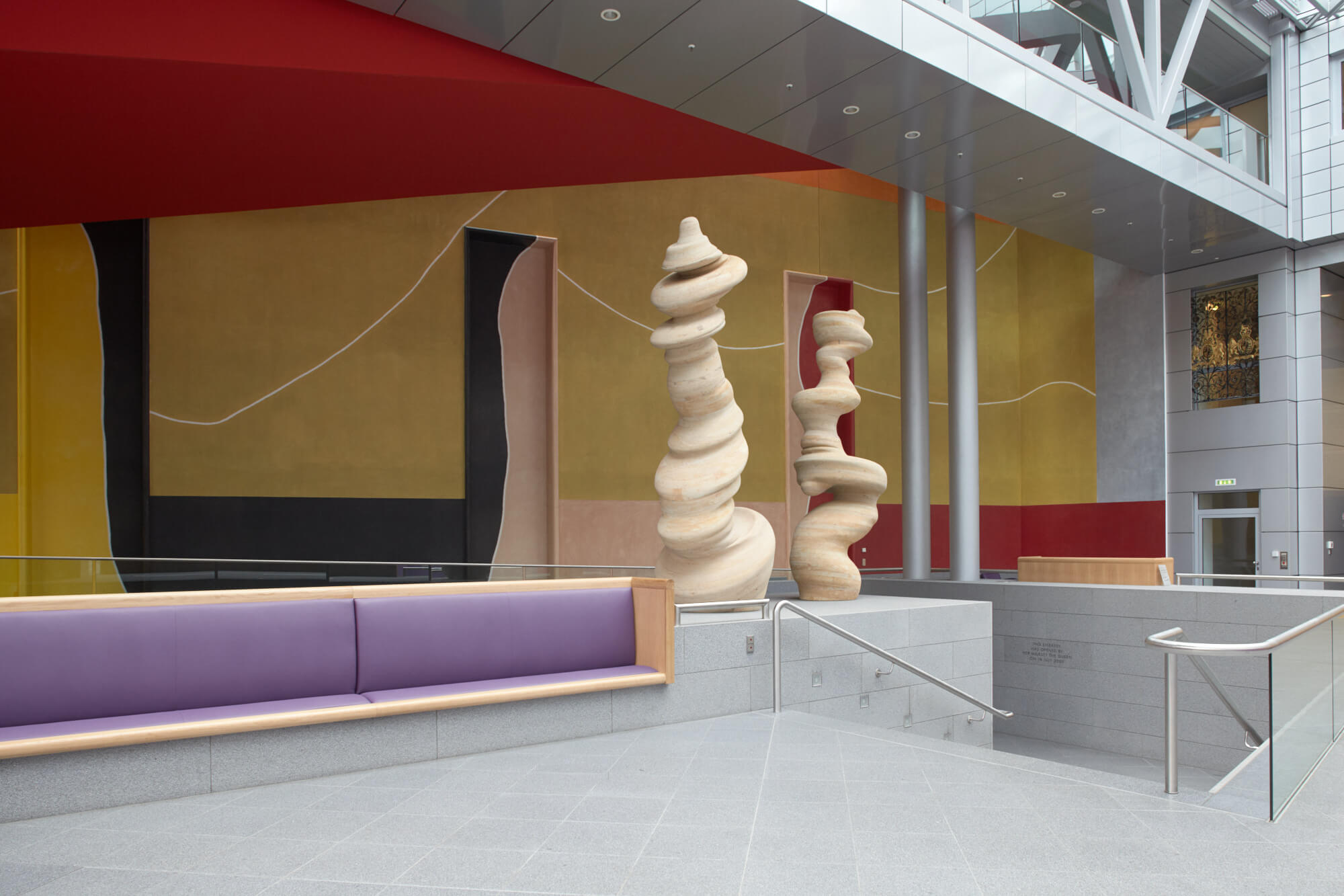 'Dancing Columns', a sculpture by Tony Cragg and behind 'Wall Drawing (for the British Embassy)' by David Tremlett can be seen in the atrium at the British Embassy, Berlin © image: Crown Copyright